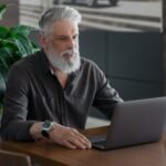 a-handsome-man-with-gray-hair-and-a-watch-on-his-h-2023-11-27-04-49-11-u-e1719306366650-1.jpg