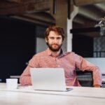 portrait-of-young-caucasian-businessman-using-lapt-2023-11-27-05-12-16-utc-1-1.jpg